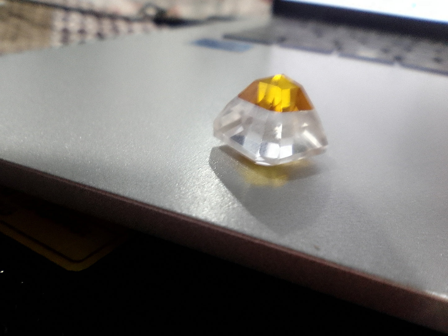  Bi-colour yellow clear Pitambari sapphire 9.90ct Asscher cut gemstone close-up facets