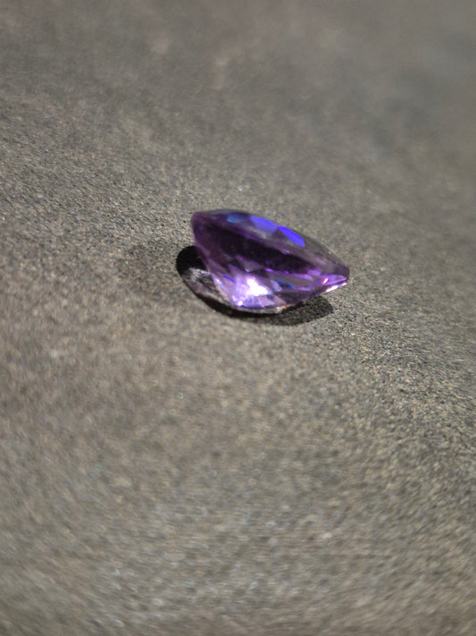 Amethyst teardrop close-up showing rich purple color and clarity